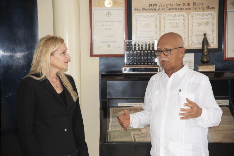 Ambassador Nicole D. Theriot with Chairman of Banks DIH Limited, Mr. Clifford Reis
