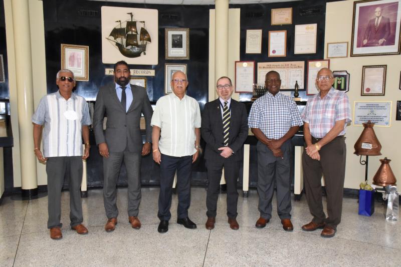 Mr, Reis with H.E. Berman and Directors of Banks DIH Limited.
